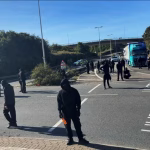 Black-Clad Patriot Group Escalates Anti-Migrant Protests in Portsmouth